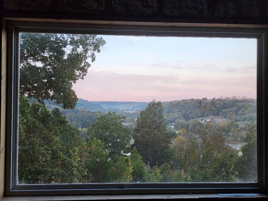 The view through the Longview Cabin window at dawn